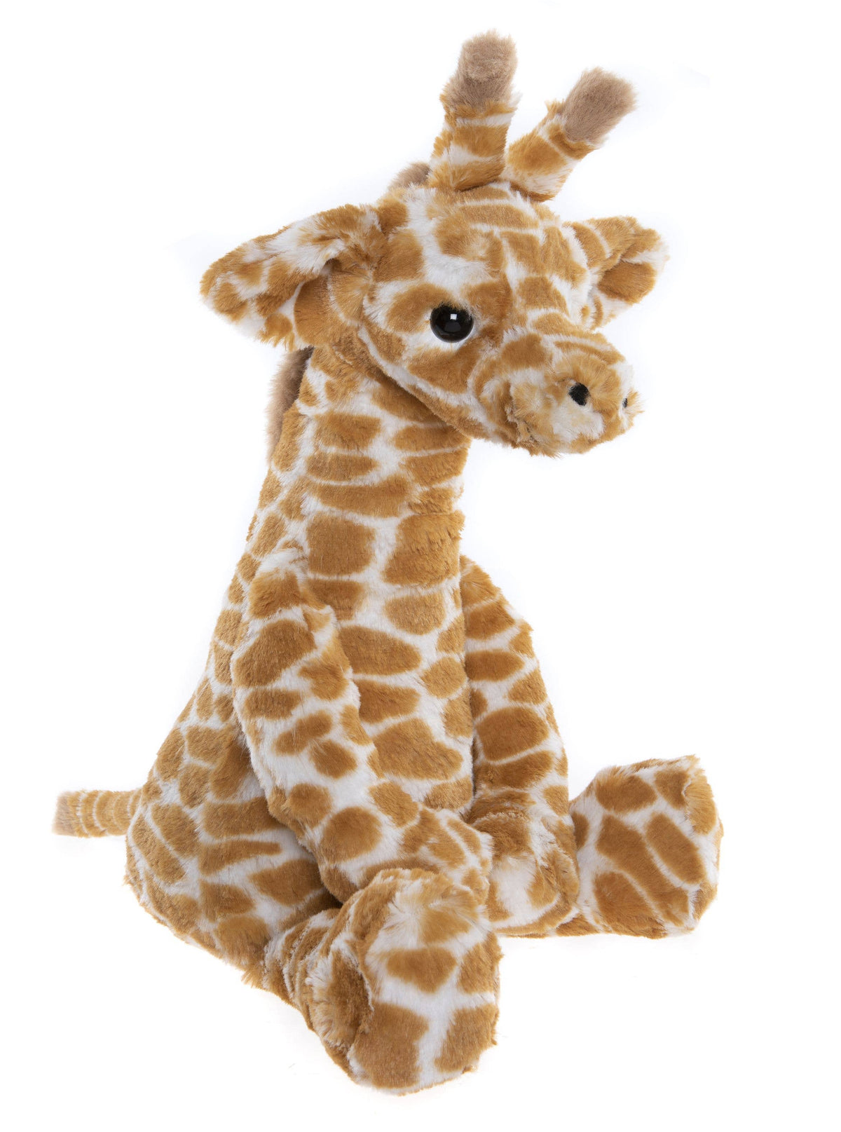 Side view of Charlie Bears Gilbert Giraffe showing his patterned plush and long neck