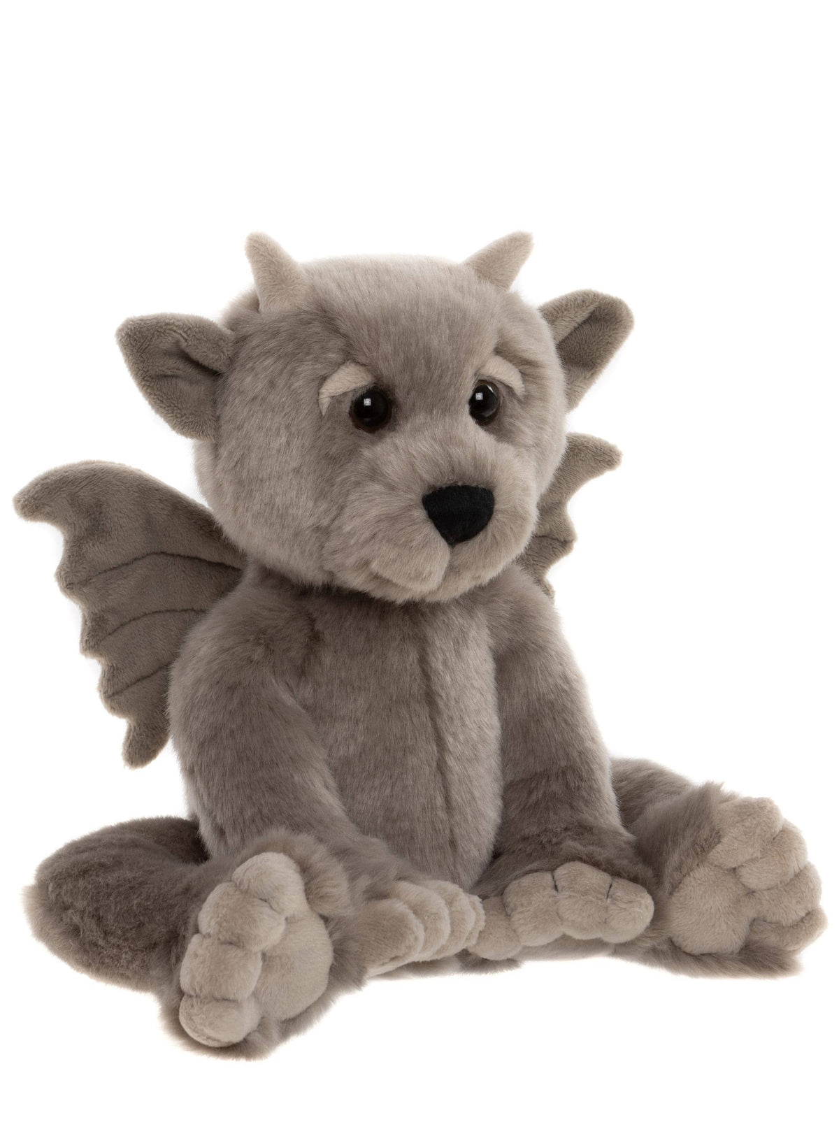 Charlie Bears Moat grey plush gargoyle in an angled seated view showing his soft wings and sculpted feet