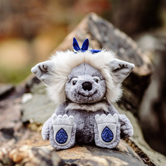 Charlie Bears Sapphire Sue from the Bearhouse collection with fluffy cream mane and embroidered sapphire gemstone paw pads