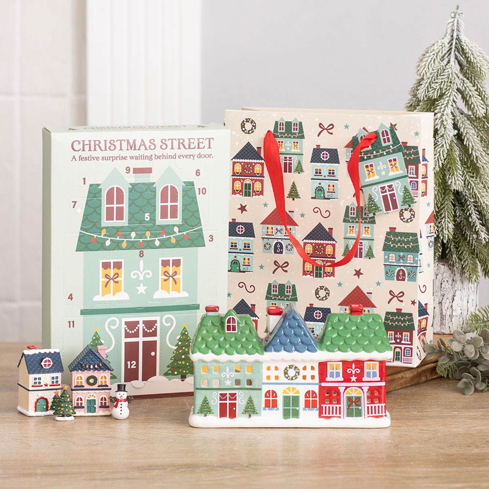 12-Day Christmas Street Scene Advent Calendar with miniature resin houses and festive decorations arranged as a Christmas village