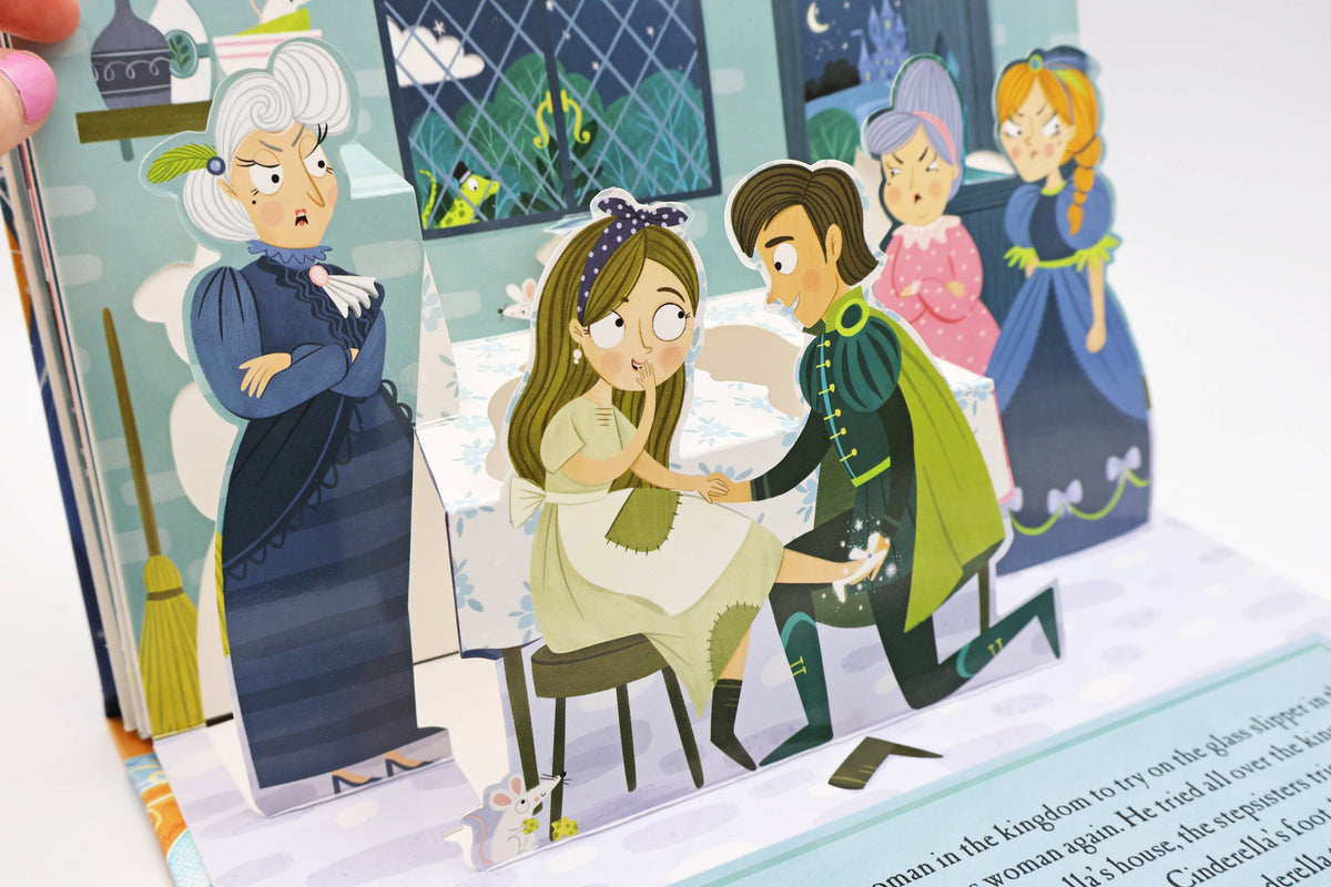 Cinderella pop-up book showing an illustrated three-dimensional scene with characters from the classic fairy tale