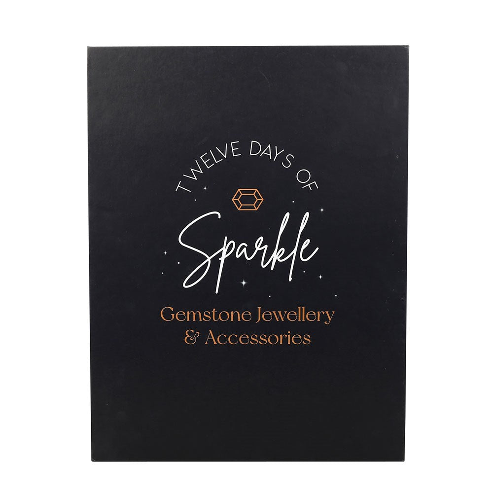 12-Day Crystal Jewellery Advent Calendar with elegant black cover, gold celestial details and Sparkle lettering
