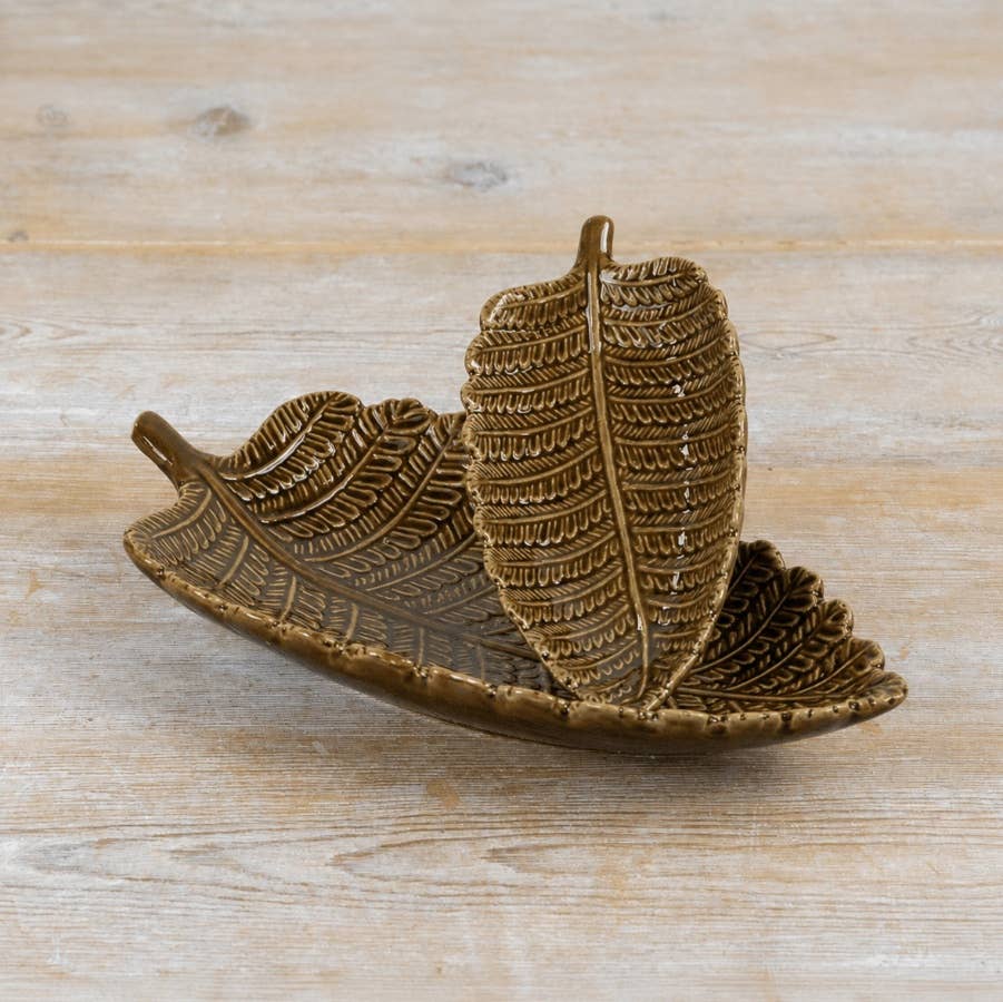 Side view of decorative leaf trinket dish showing the raised leaf shape and detailed textured finish