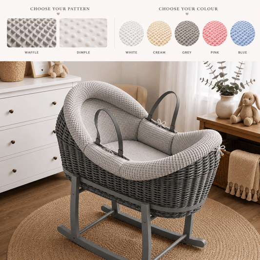 Deluxe Wicker Pod Baby Moses Basket in grey with coordinating bedding and wooden rocking stand in a nursery
