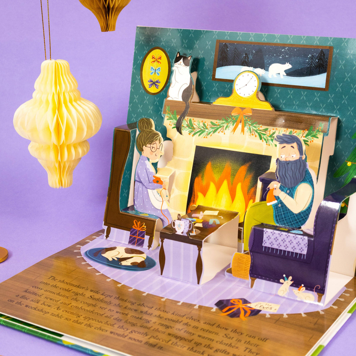The Elves and the Shoemaker pop-up book showing a colourful three-dimensional fireside scene with the shoemaker and his wife.