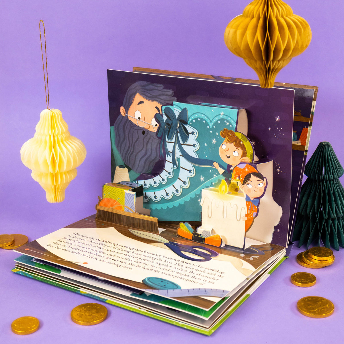 The Elves and the Shoemaker children's pop-up book opened against a purple background showing its colourful three-dimensional illustrations