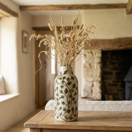 Foliage Ceramic Vase with dried grasses and seed heads styled on a wooden table in an English country cottage