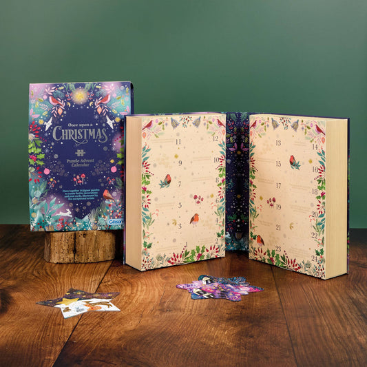 Once Upon a Christmas 24 Mini Jigsaw Puzzles Advent Calendar by Gibsons, showing the illustrated box and open book-style calendar.