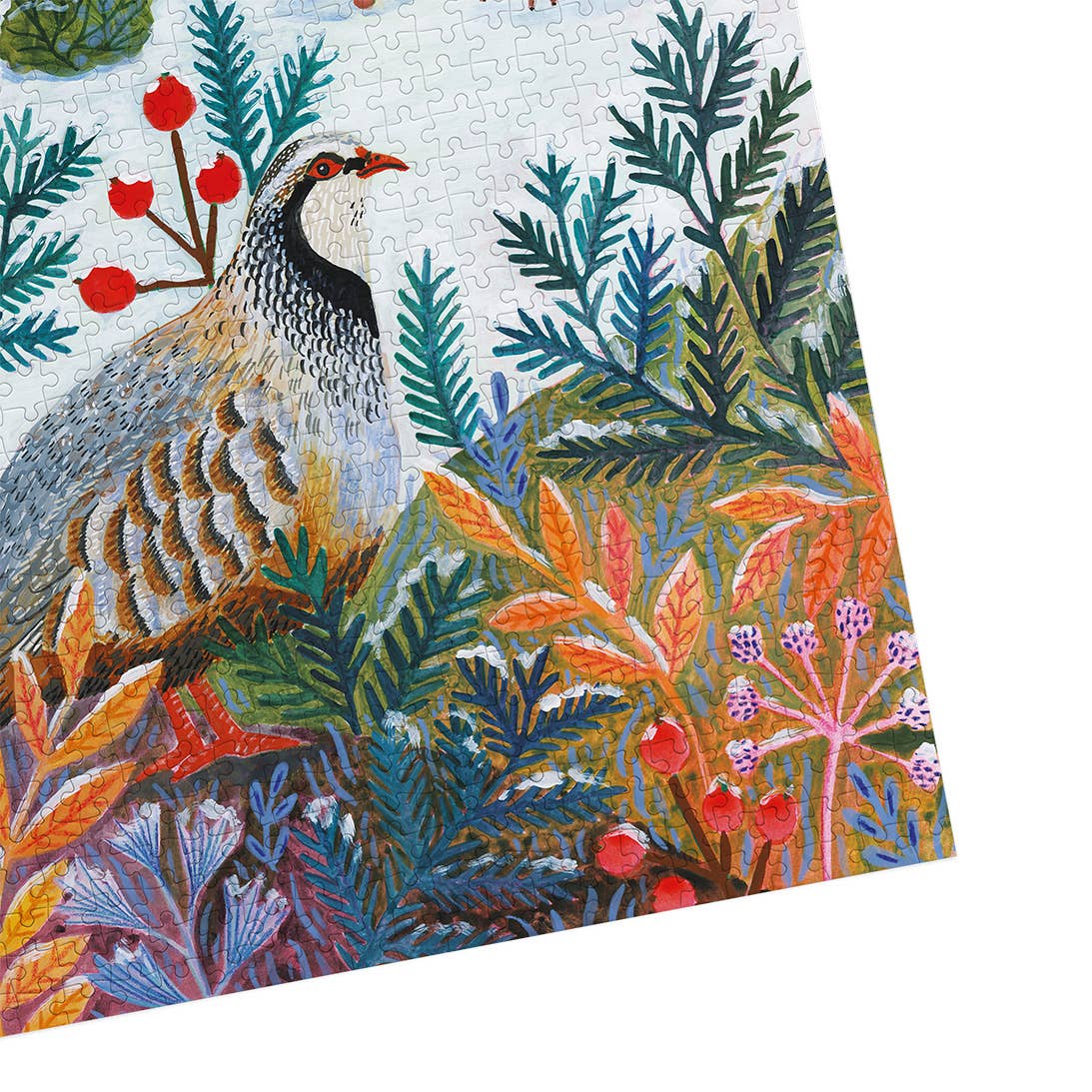 Frosty Fauna Gibsons jigsaw puzzle photographed at an angle, showing the assembled winter birds design with detailed woodland foliage.
