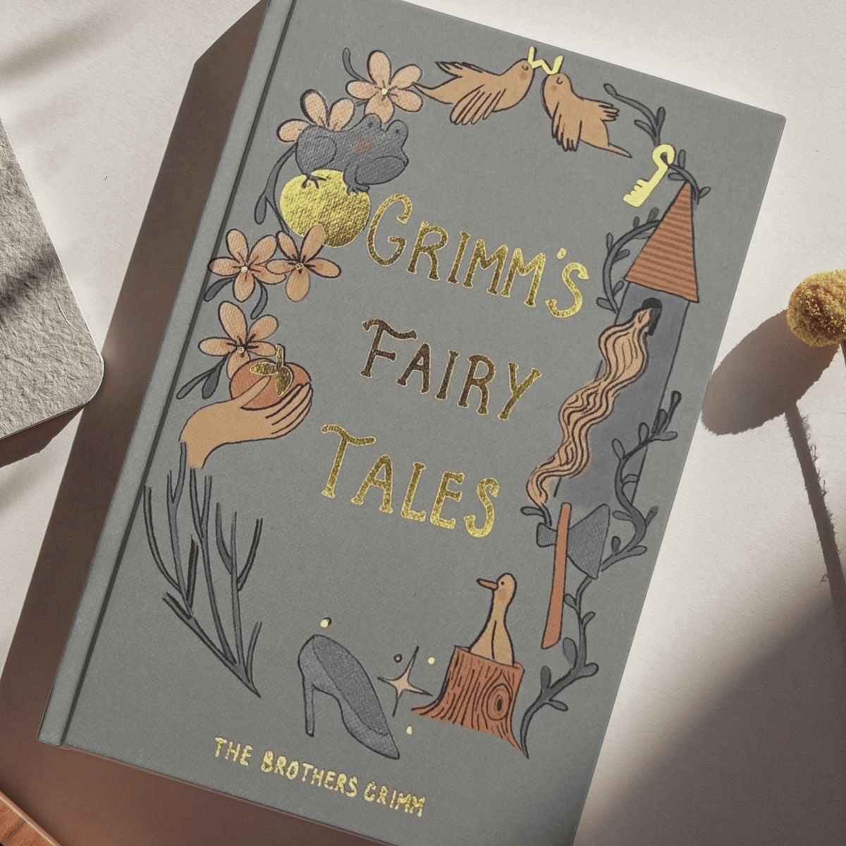 Grimm's Fairy Tales by the Brothers Grimm Wordsworth Collector's Edition hardback with grey illustrated cover and gold detailing