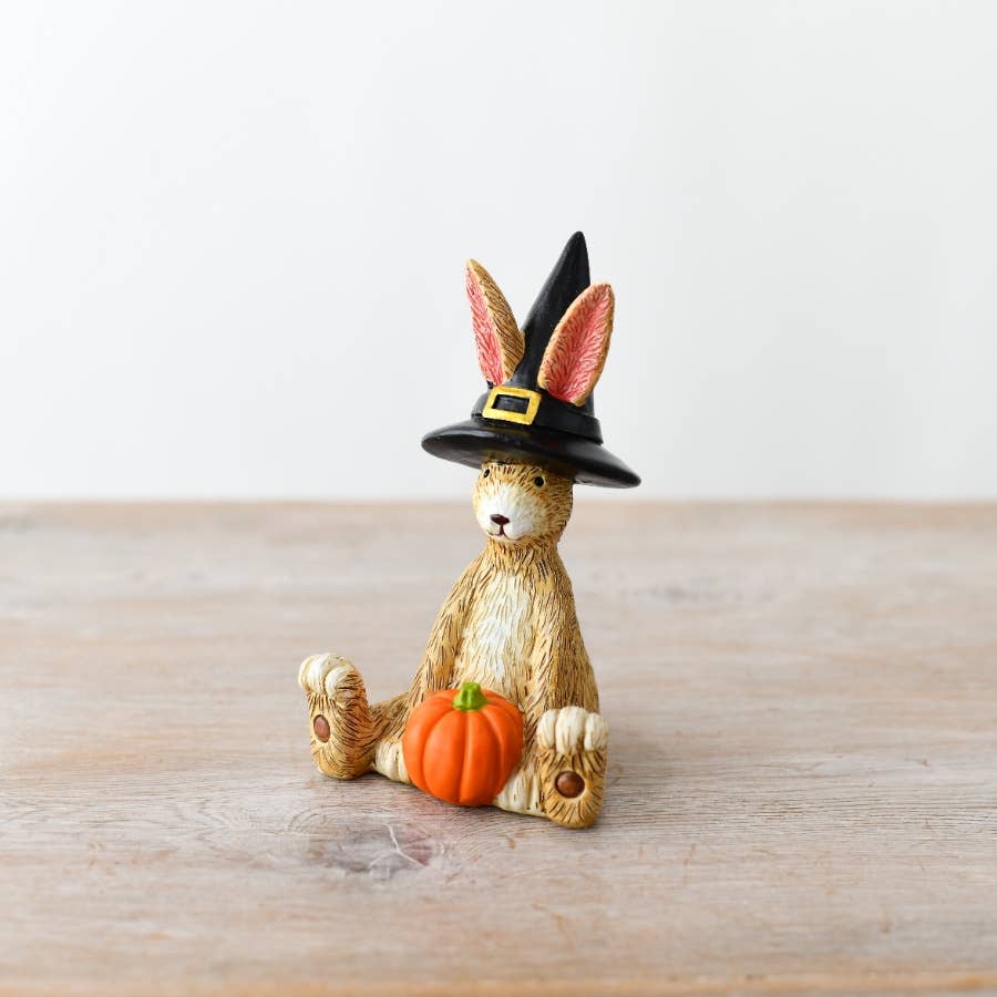 Jasper Rabbit Witch Ornament 11cm wearing a black witch's hat and sitting with an orange pumpkin
