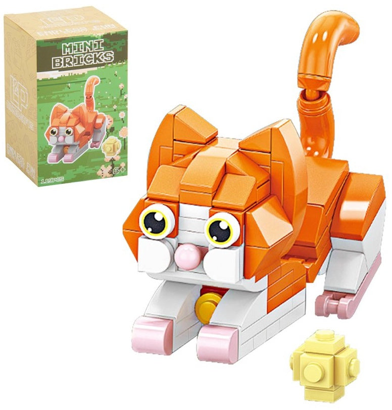 Kitten Model Brick Kit featuring a ginger and white miniature cat with curled tail, yellow toy and illustrated retail packaging.