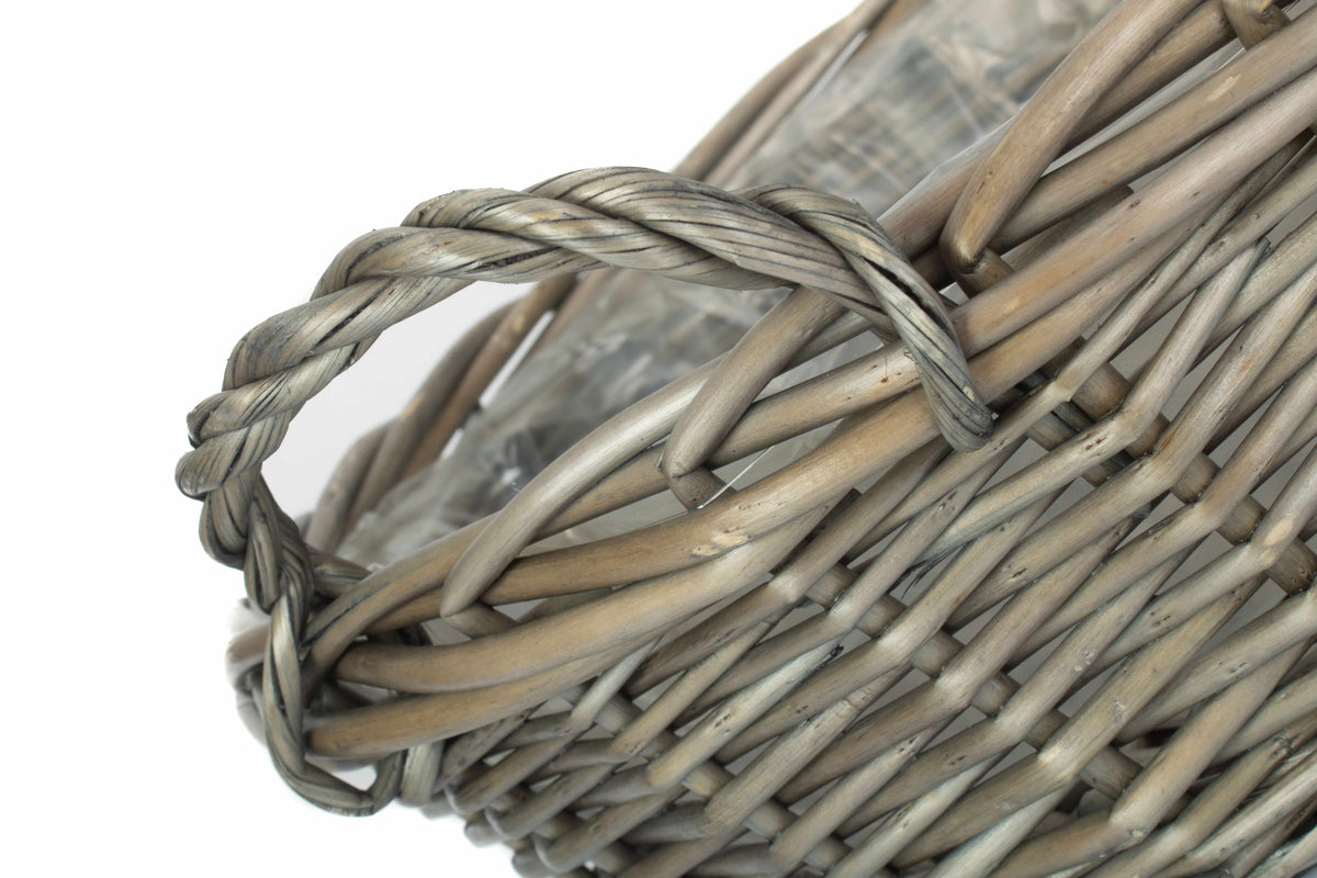 Large round antique wash willow display basket close-up showing the twisted willow handle and traditional woven rim