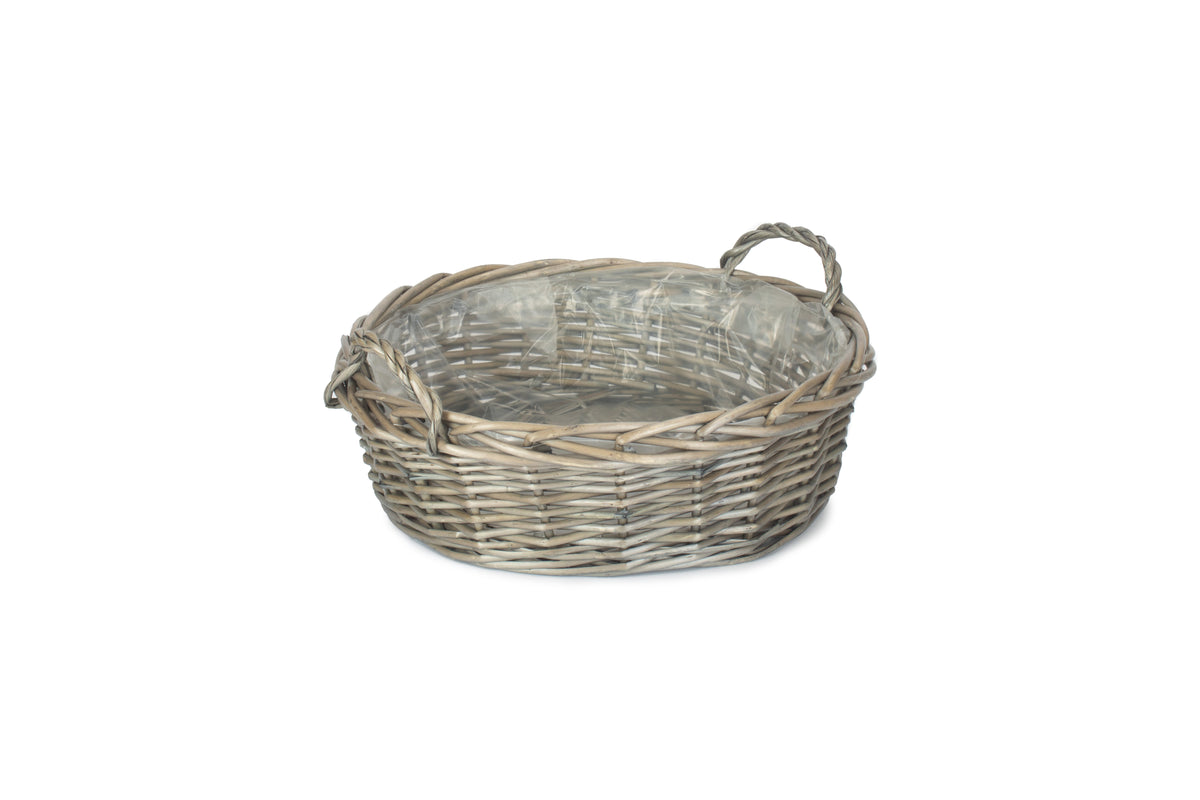 Large round antique wash willow display basket with clear plastic lining and two woven ear handles