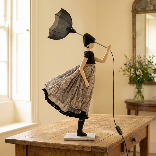 Lyra Lady table lamp displayed on an aged oak table in a light English country house interior