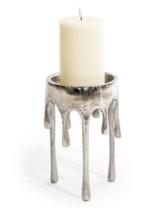 Medium Raw Nickel Dali Drip Candle Holder with sculptural melting-wax design and cream pillar candle against a white background