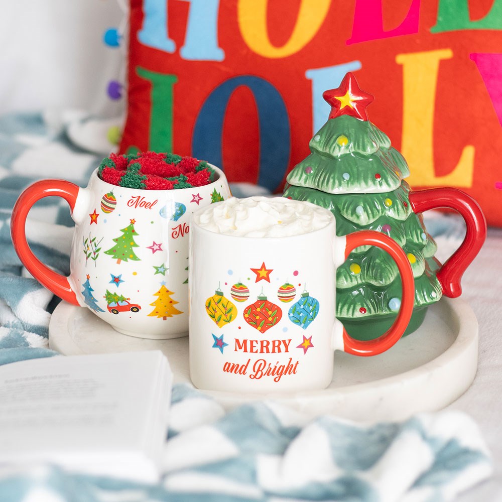 Merry and Bright Christmas Mug displayed with festive Christmas decorations, colourful ornaments and seasonal table styling
