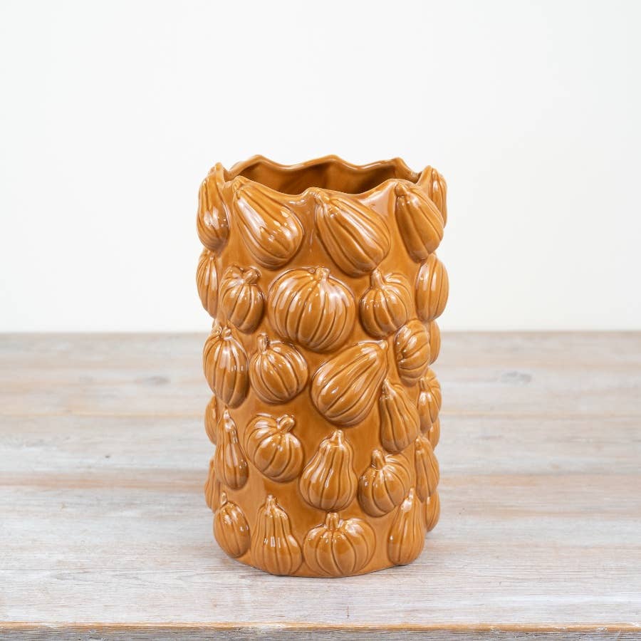 Orange ceramic flower vase with raised all-over pumpkin design, 24.5cm
