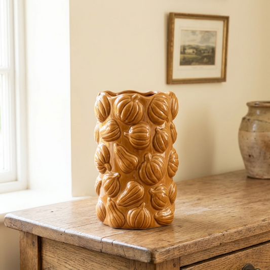 Orange Pumpkin Ceramic Vase displayed empty on an aged oak table in a light English country interior