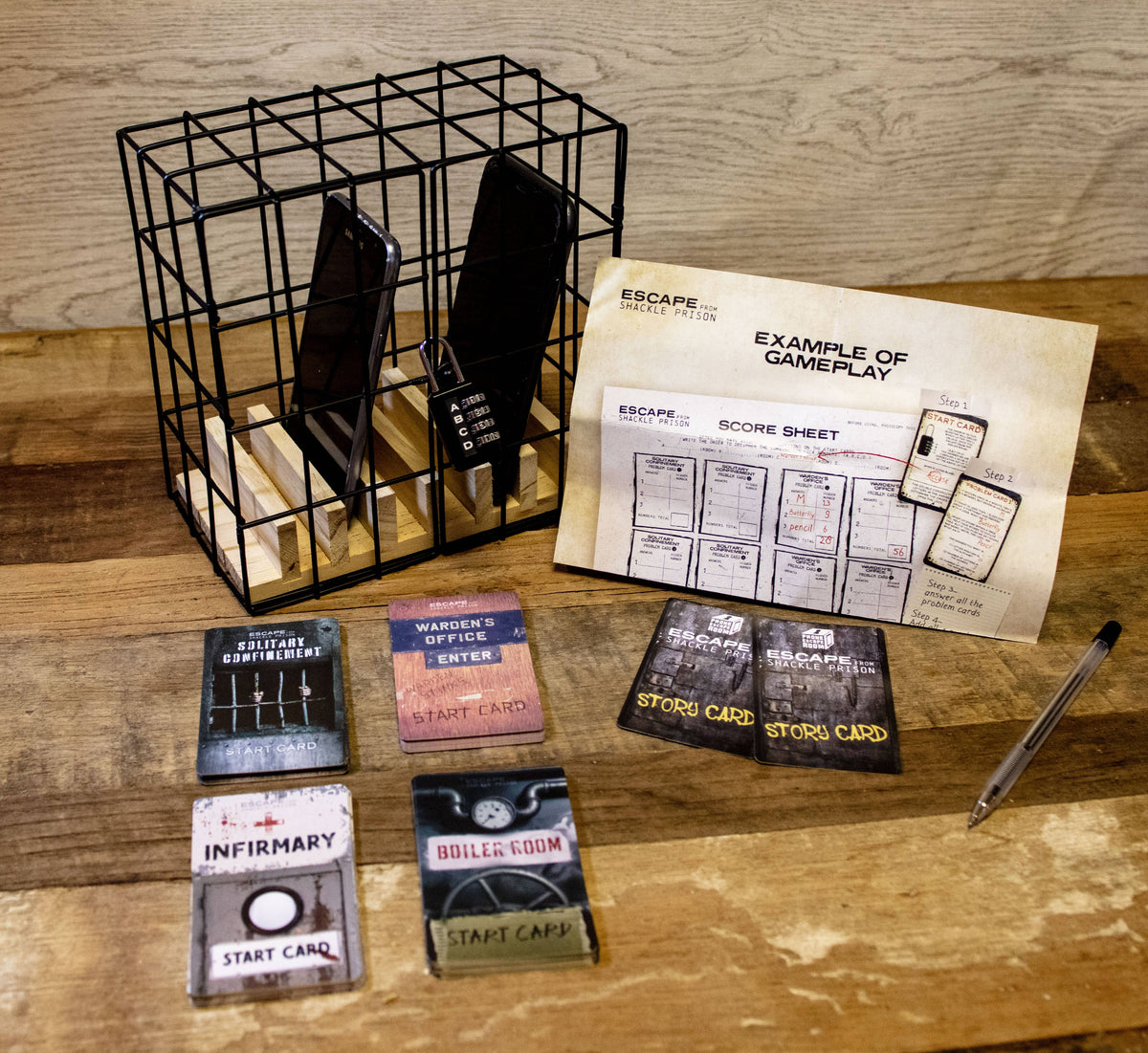 Phone Escape Room Puzzle Game contents with phone cage, challenge cards, padlock and score sheet
