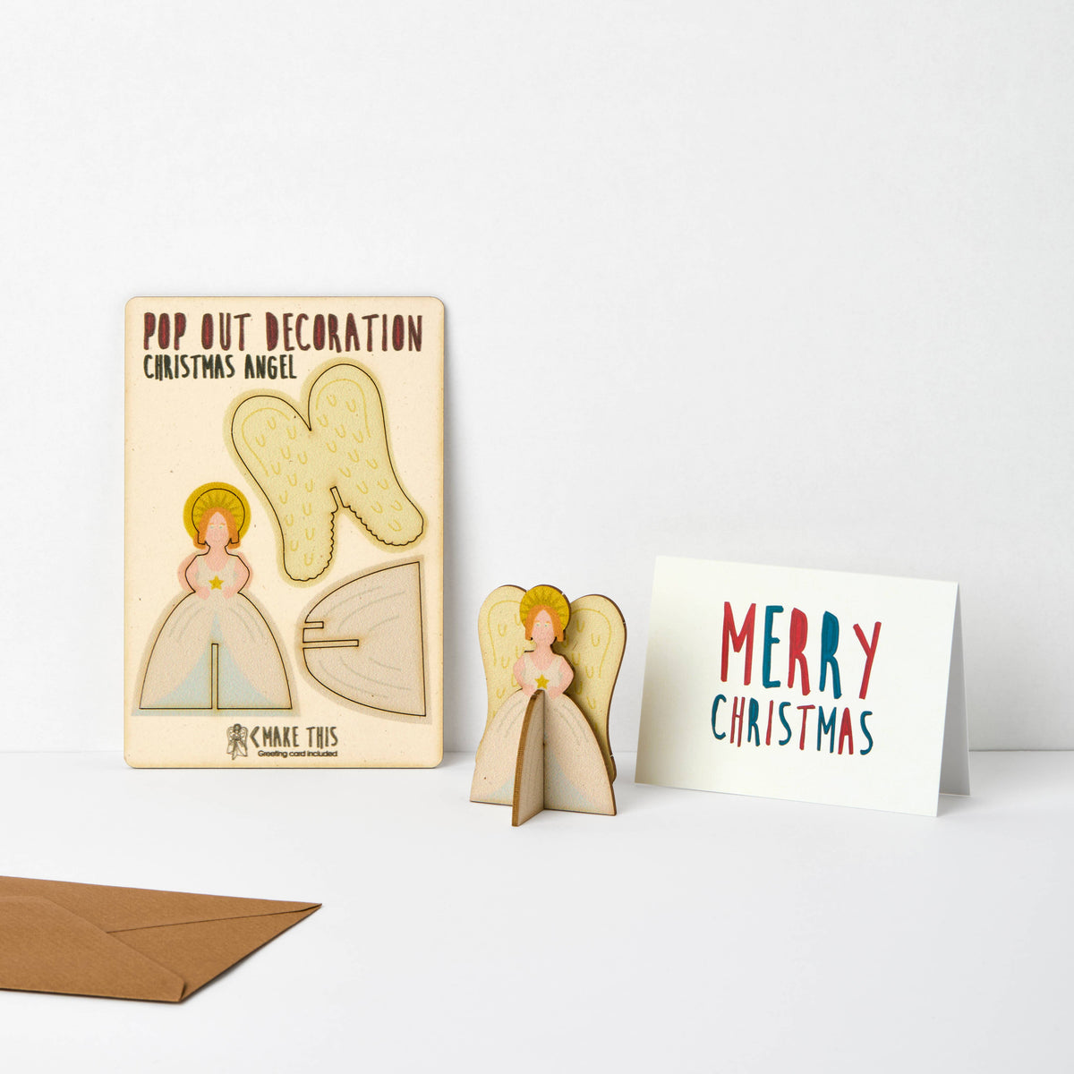 Pop Out Angel Christmas Card showing the flat pop-out design, assembled wooden angel and Merry Christmas card