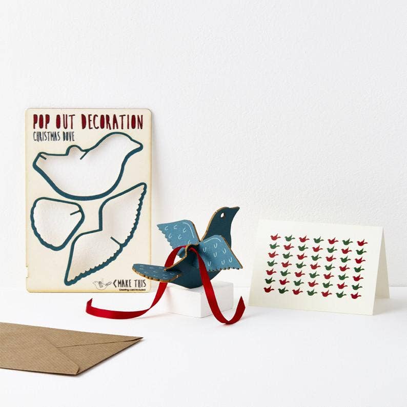 Pop Out Dove Christmas Card showing the pop-out sheet, assembled wooden dove, red ribbon and patterned greeting card