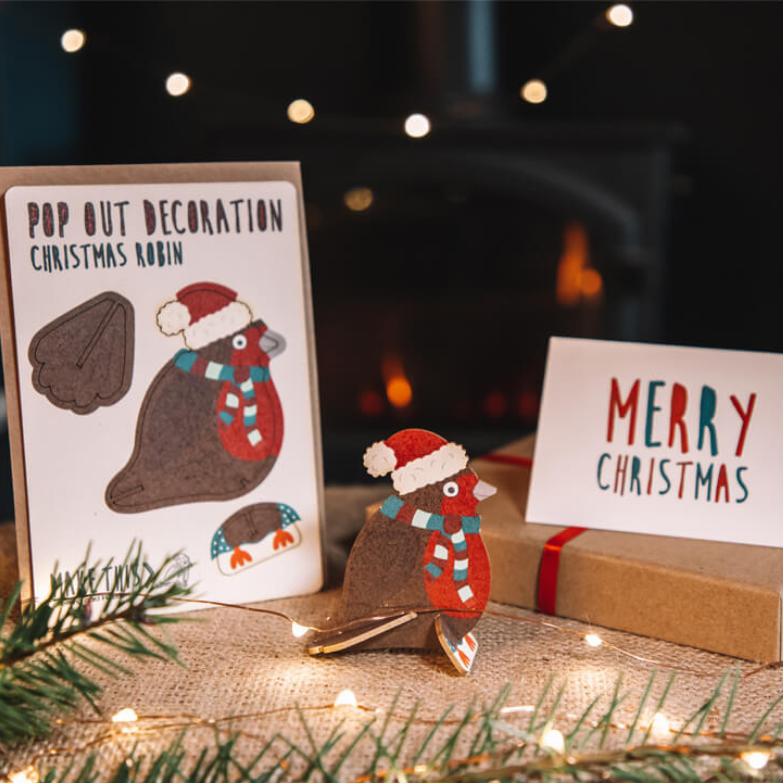 Pop Out Robin Christmas Card assembled as a festive robin decoration beside the Merry Christmas message card