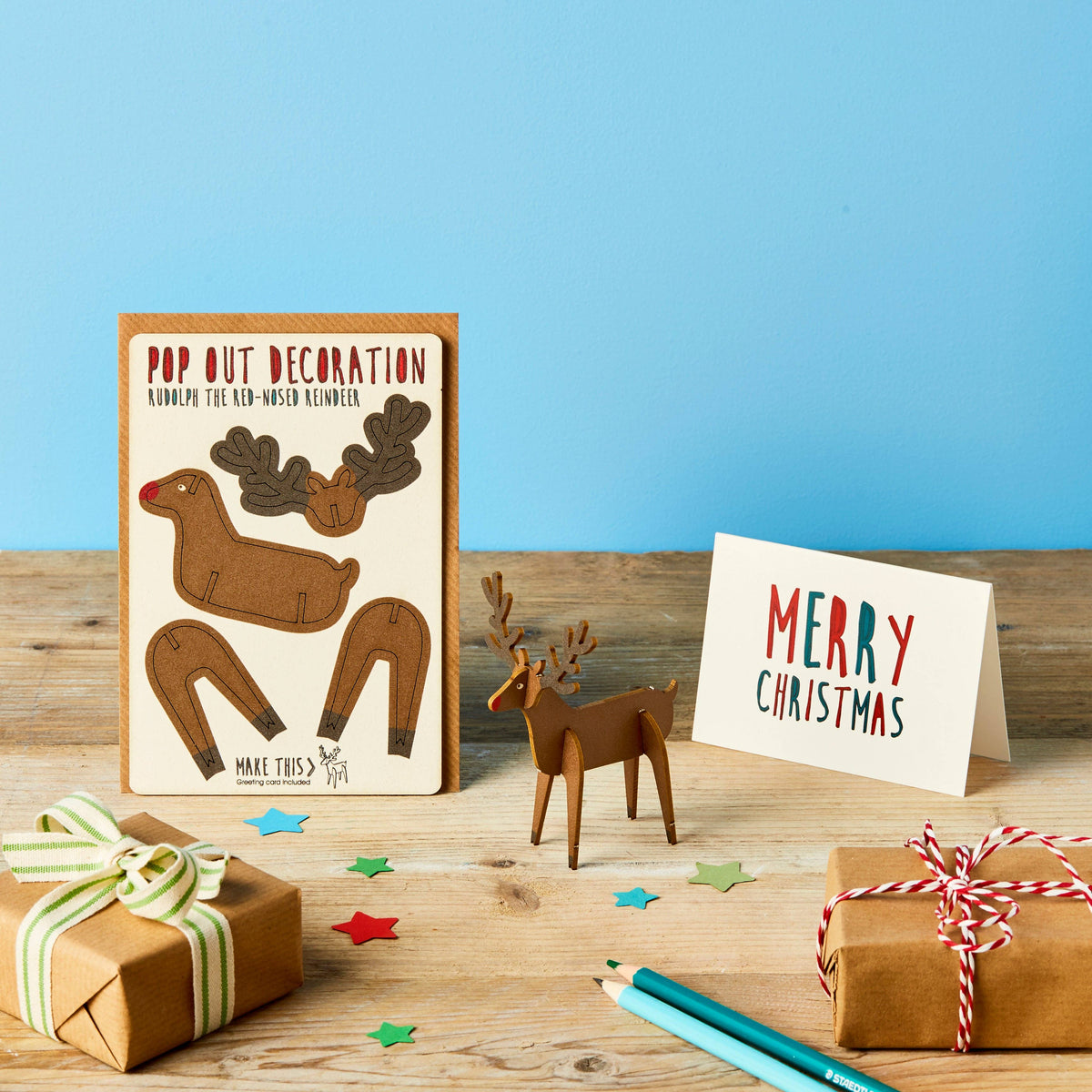 Pop Out Rudolph Christmas Card with assembled wooden reindeer, Merry Christmas card and wrapped festive gifts