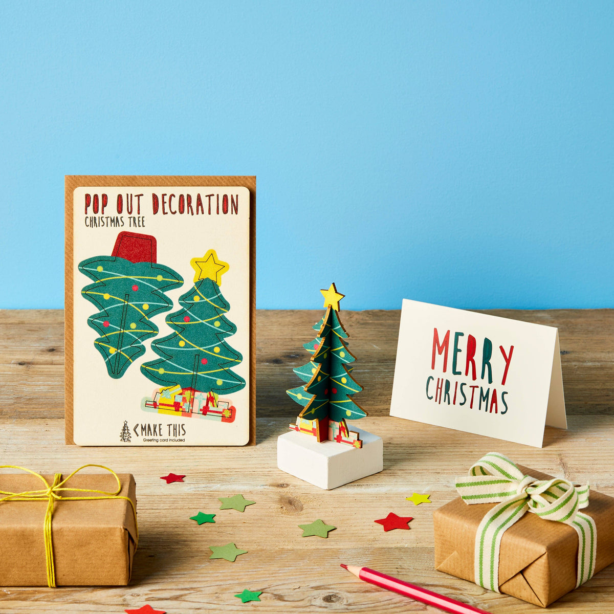 Pop Out Standing Christmas Tree Card with assembled wooden tree decoration, presents and Merry Christmas message card