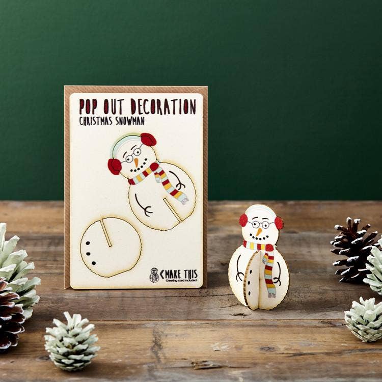 Pop Out Standing Snowman Christmas Card with assembled wooden snowman decoration styled in a festive Christmas setting