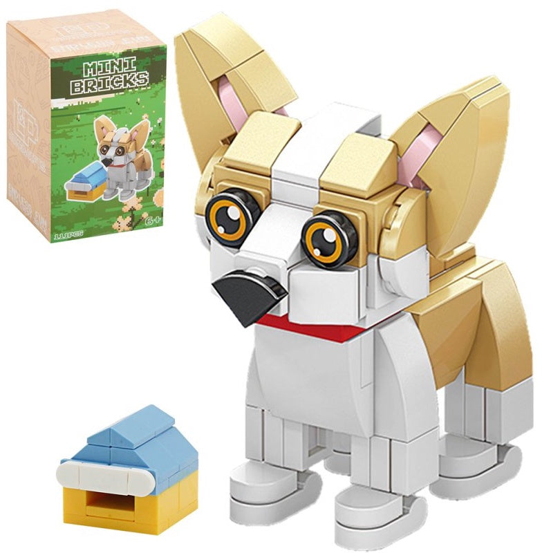 Puppy Model Brick Kit showing a tan and white miniature dog with large ears, red collar, small colourful accessory and illustrated retail packaging.