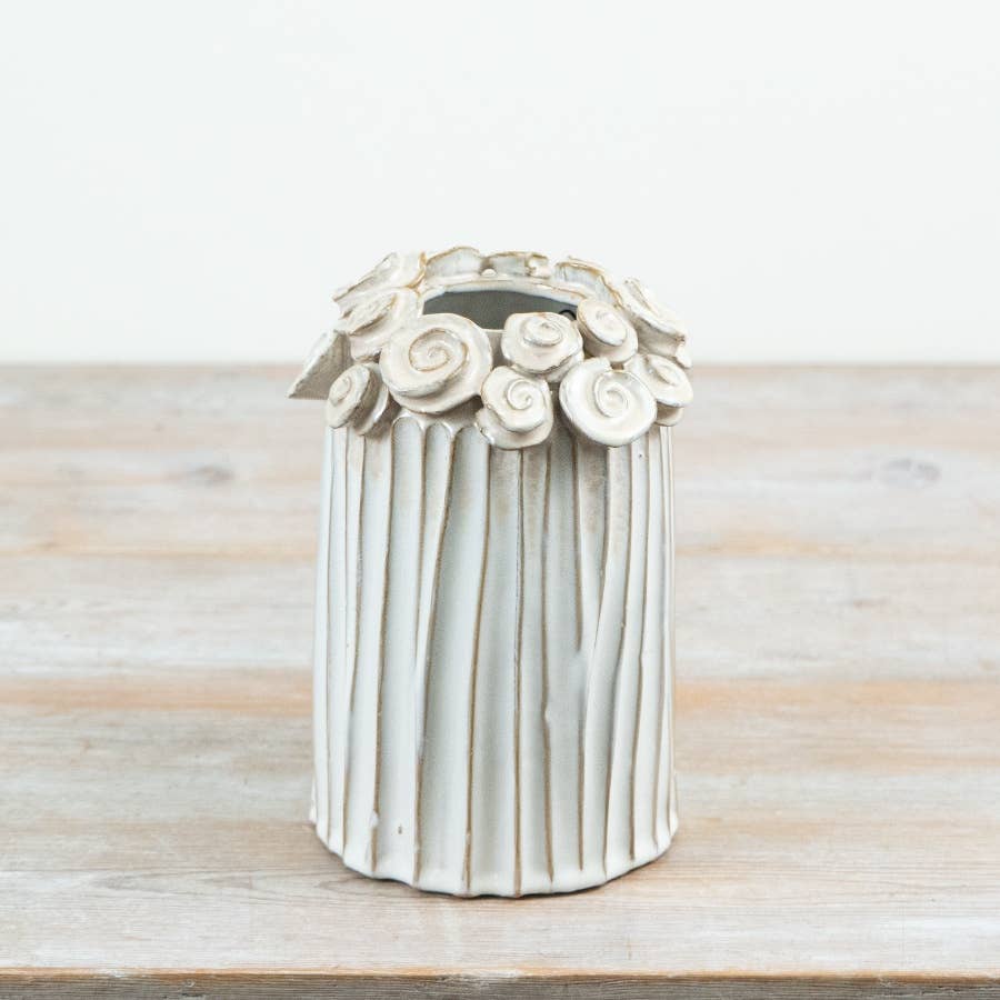 White ceramic vase with ribbed design and sculpted flowers around the rim, 21.5cm