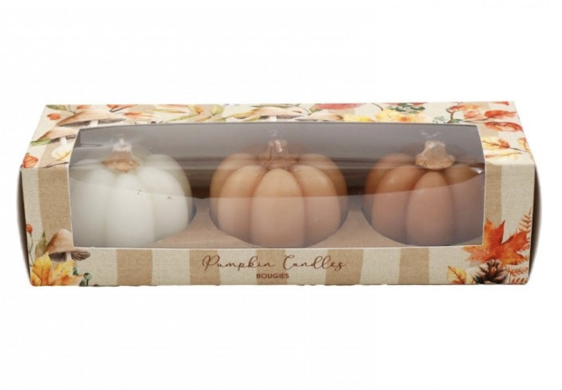 Set of three pumpkin-shaped candles in cream and warm autumn tones