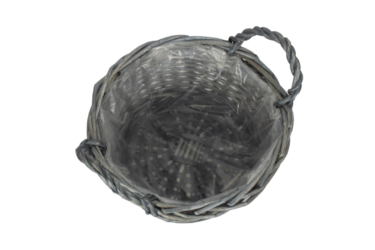 Small round antique wash willow display basket viewed from above showing the clear plastic lining and woven willow base