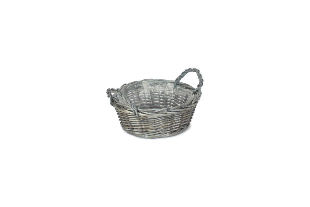 Small round antique wash willow display basket with clear plastic lining and two twisted willow carrying handles
