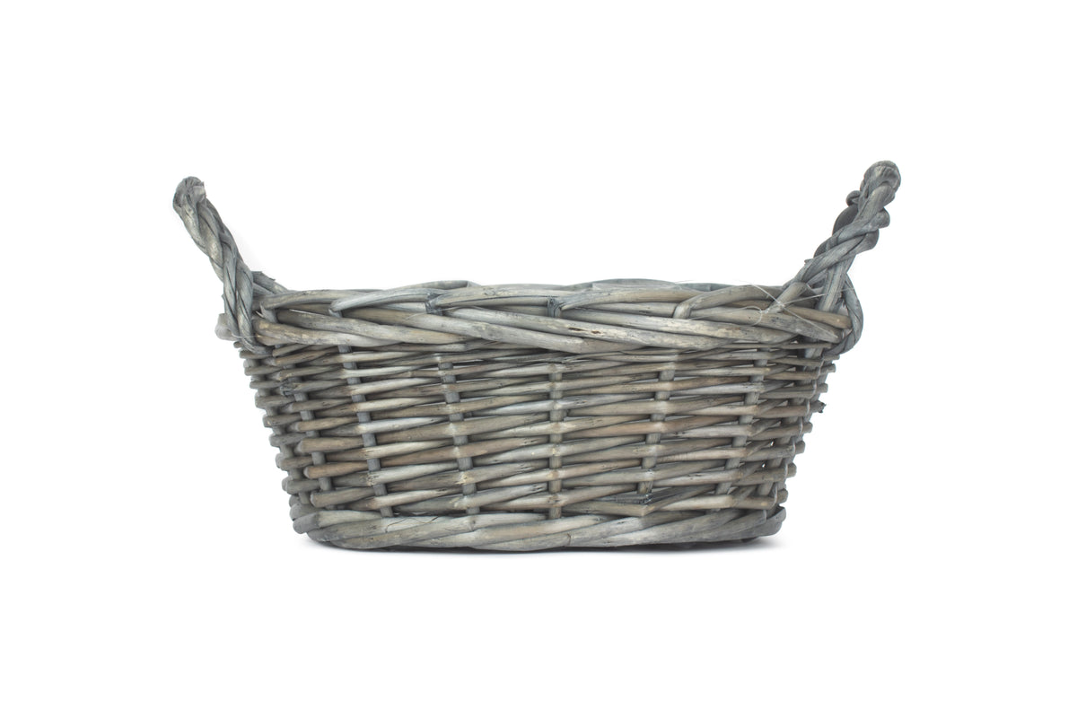 Small round antique wash willow display basket side view showing its compact shape, traditional weave and ear handles