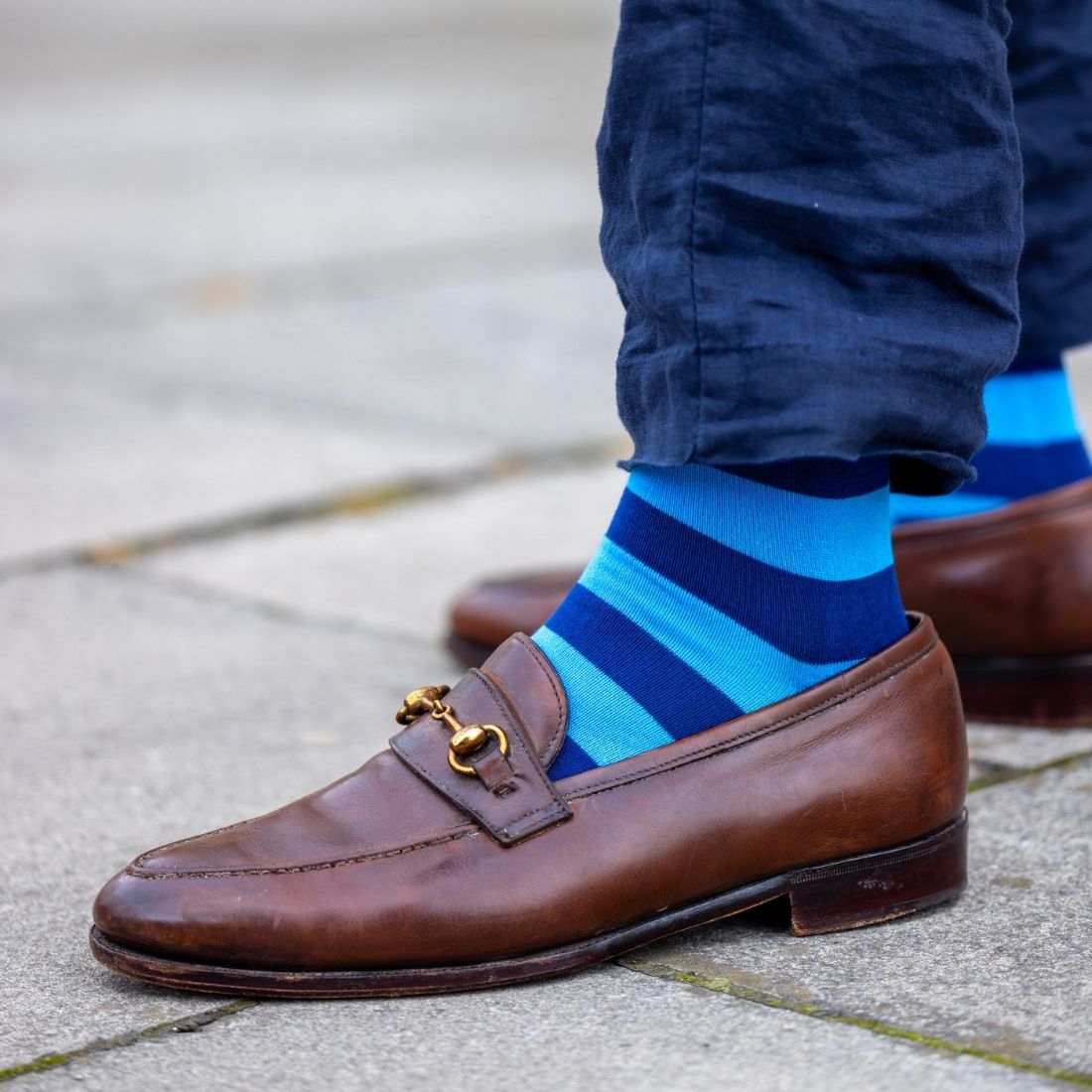 Blue Swole Panda bamboo socks worn with jeans and brown leather shoes