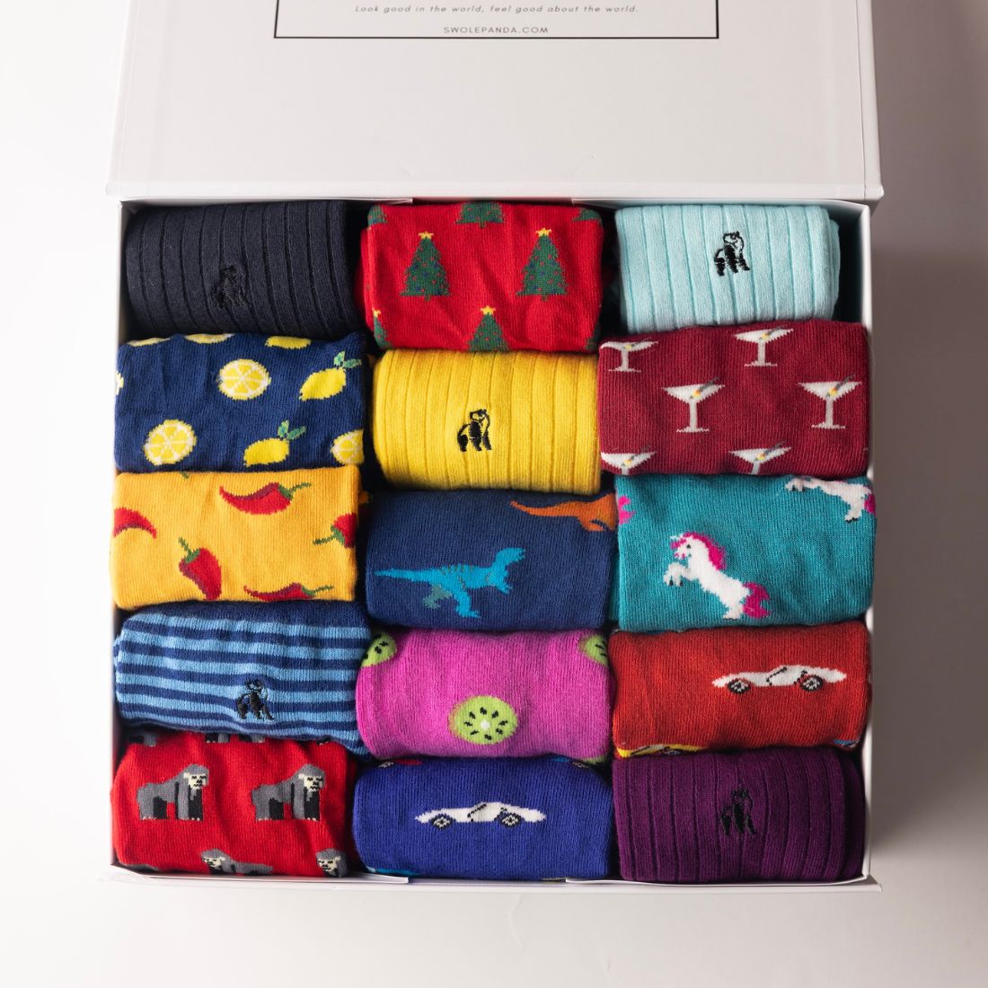 Open Swole Panda sock box with a colourful selection of bamboo socks