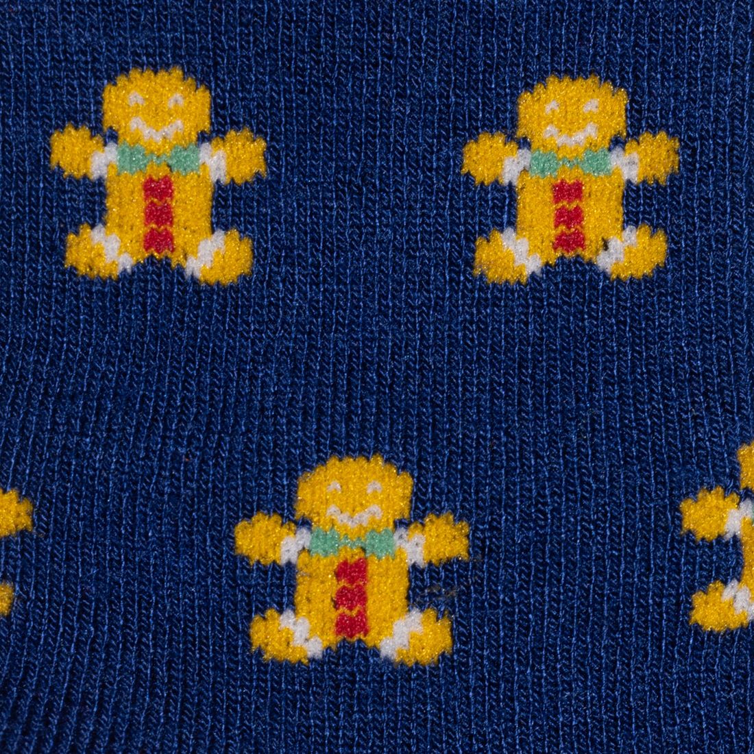 Close-up of gingerbread men pattern on navy Swole Panda bamboo socks
