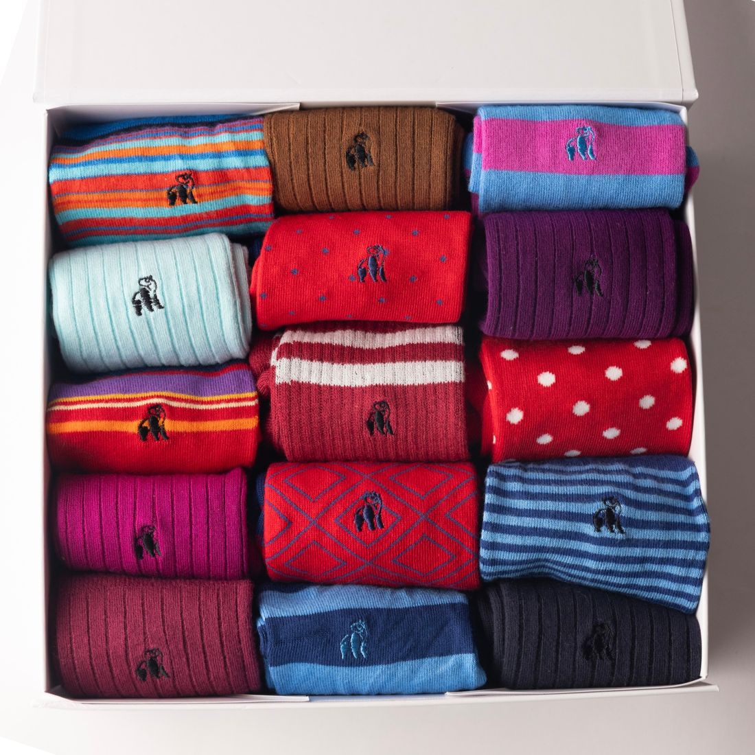 Open Swole Panda gift box with an assorted selection of colourful bamboo socks
