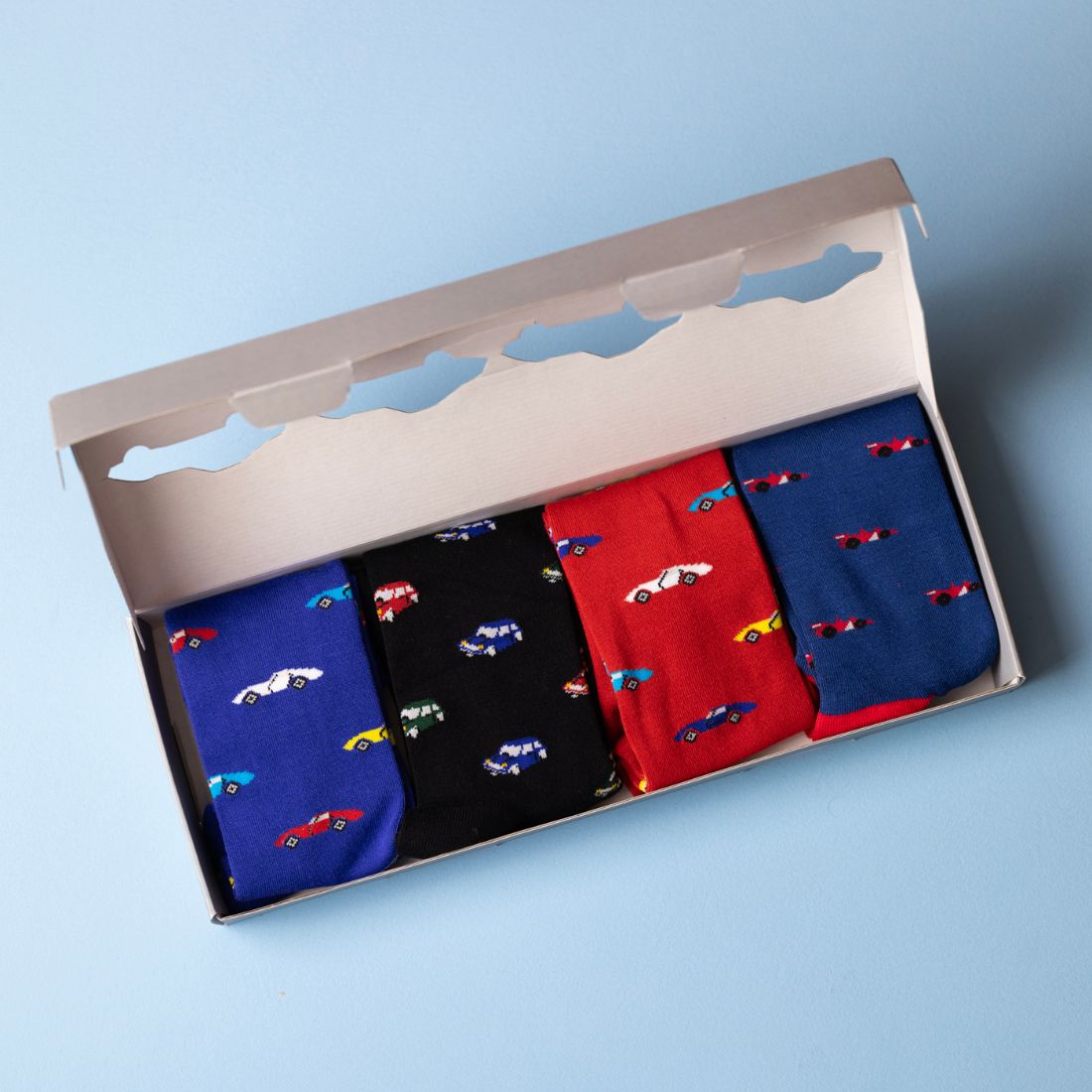 Open Swole Panda Racing Car Sock Box showing four pairs of bamboo socks