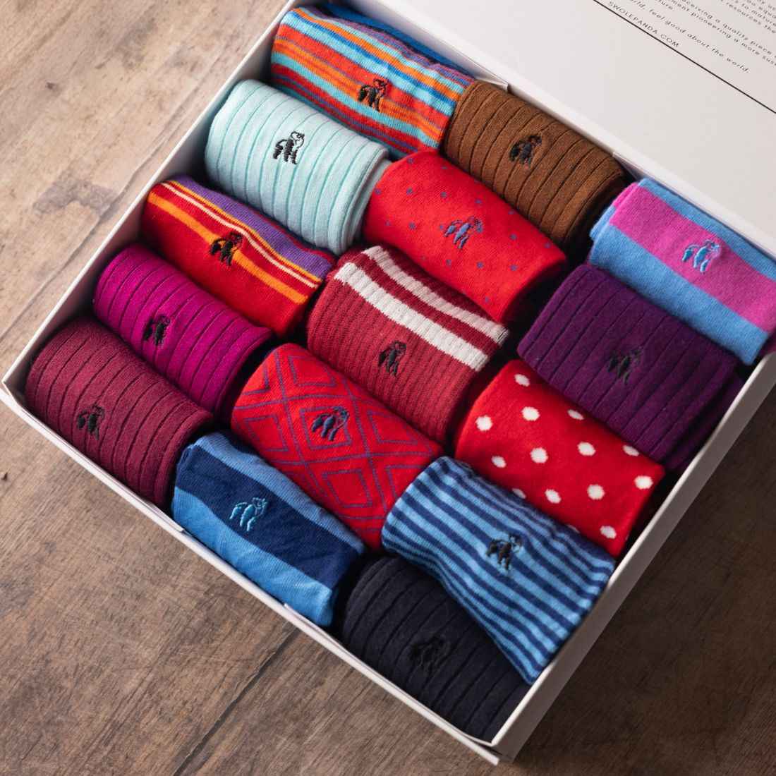 Swole Panda gift box with a colourful selection of red and blue bamboo socks