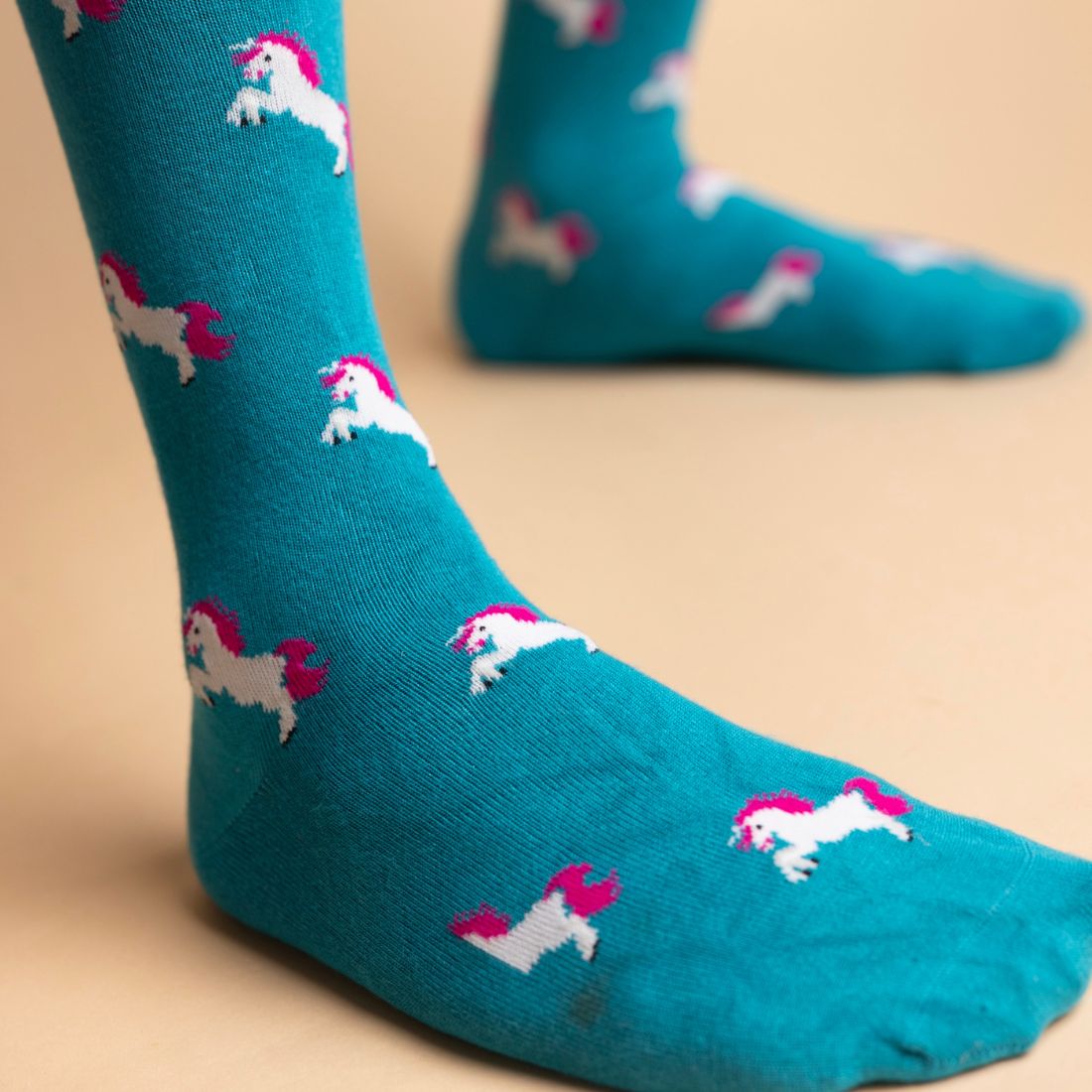 Turquoise Swole Panda bamboo socks featuring a colourful animal-inspired pattern