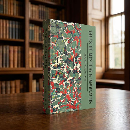 Tales of Mystery and Imagination by Edgar Allan Poe paperback on a wooden table in a traditional library