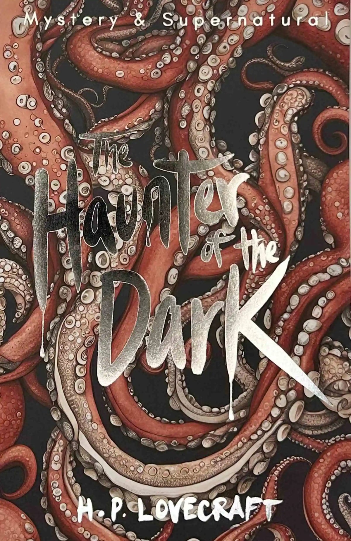 The Haunter of the Dark by H. P. Lovecraft, Wordsworth paperback featuring an illustrated cover with twisting red tentacles against a dark background