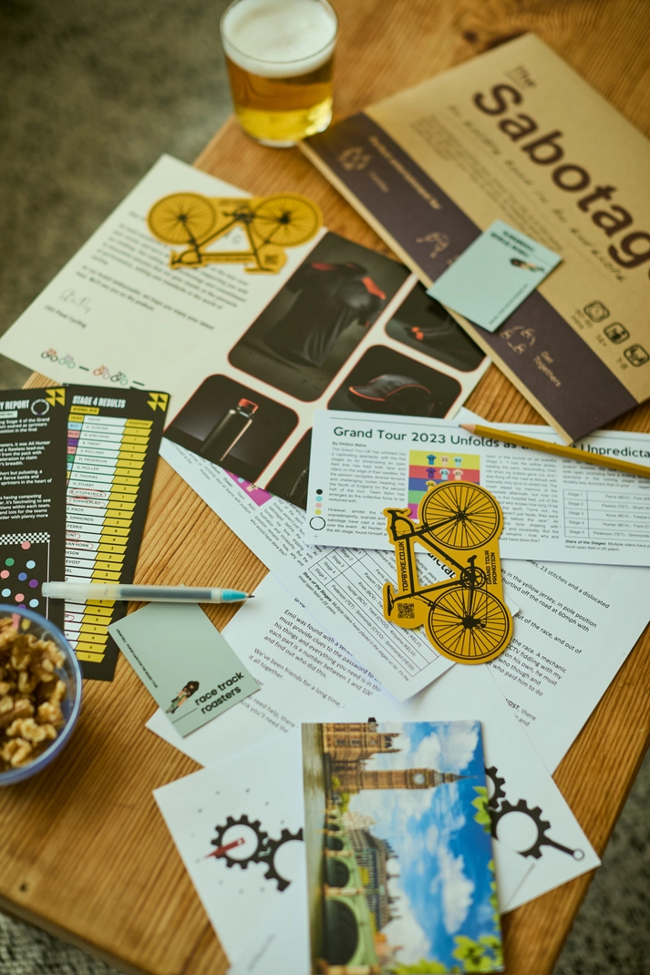 The Sabotage cycling-themed escape room puzzles and clues arranged on a table
