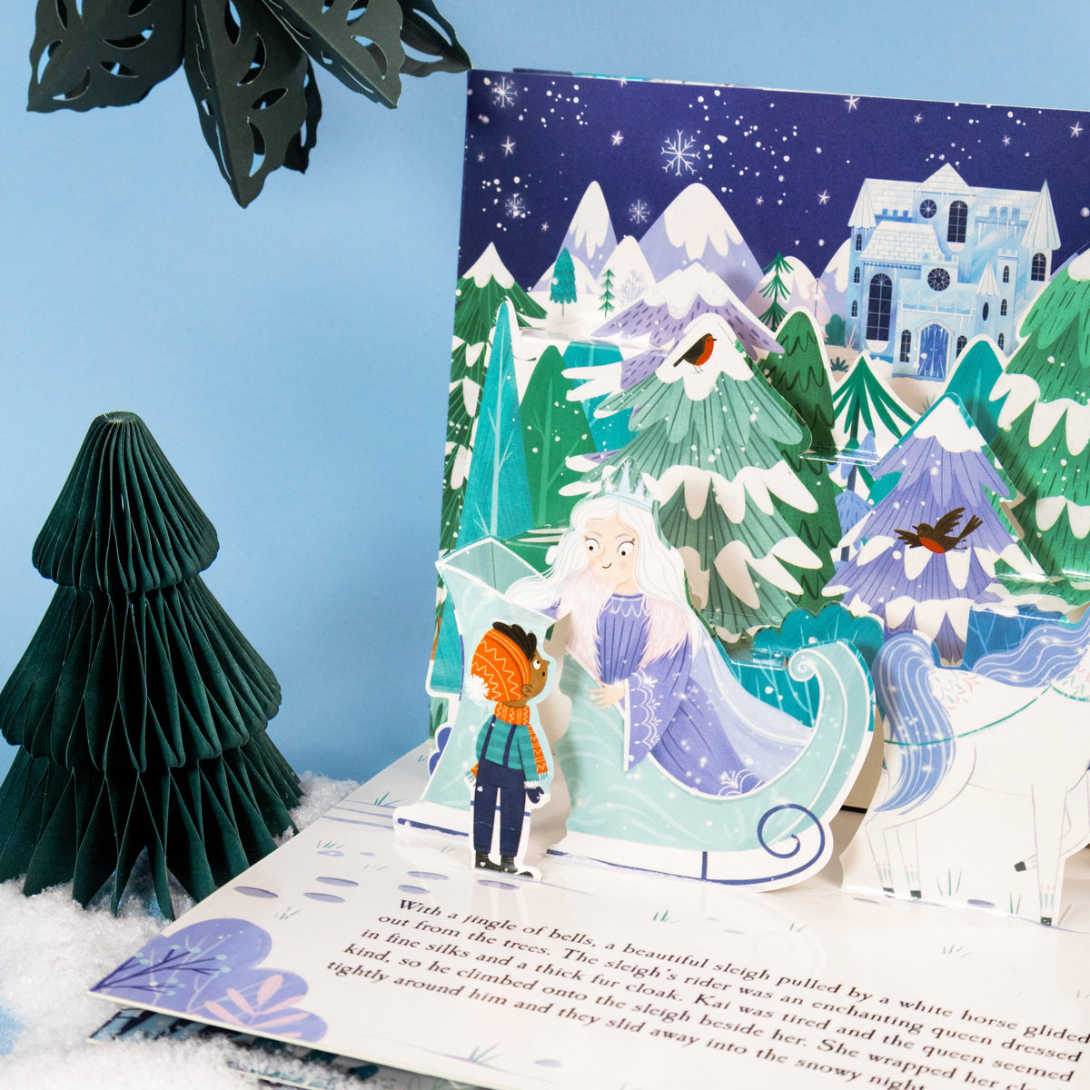 The Snow Queen pop-up book showing an illustrated three-dimensional scene from Gerda's magical adventure