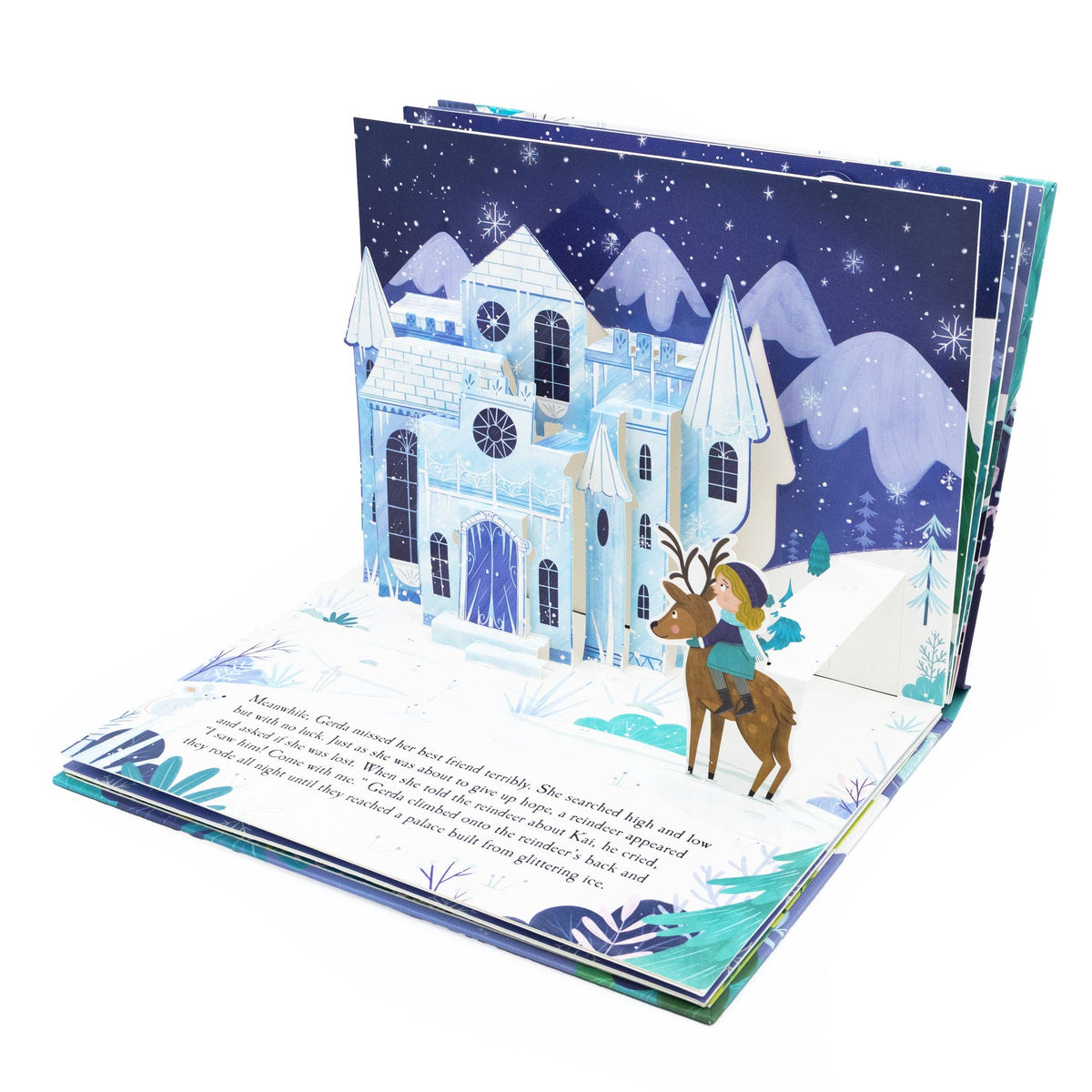 The Snow Queen pop-up book opened to reveal a three-dimensional snowy fairy-tale scene