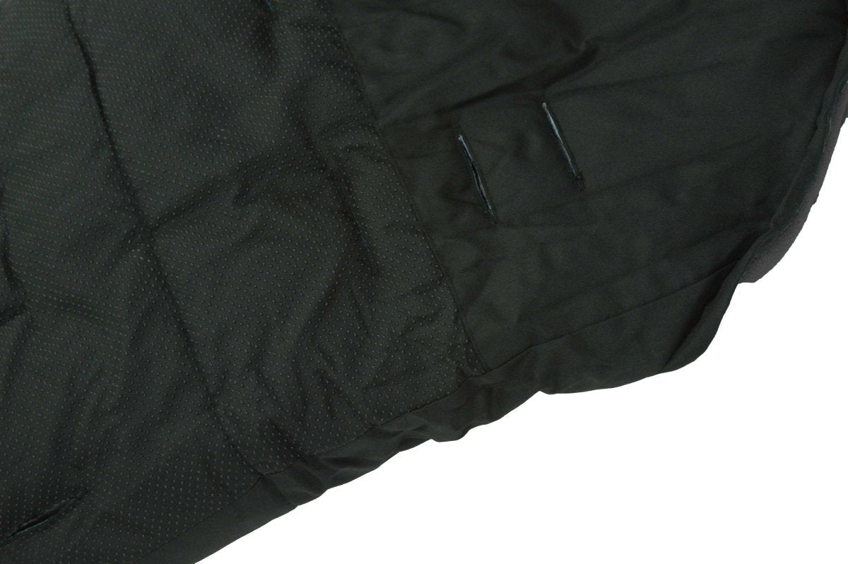 Close-up of a black quilted footmuff with a white background