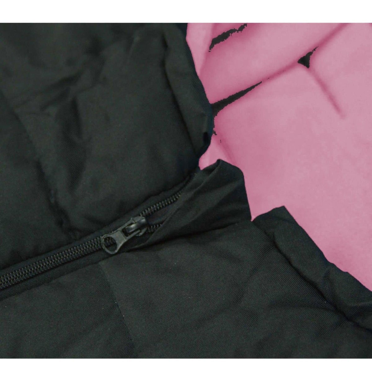 Close-up of a black and pink fabric with a zipper detail